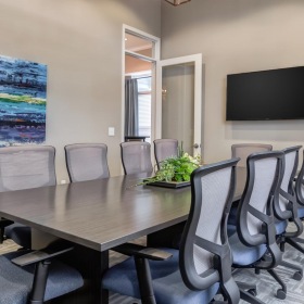 Everything within reach a conference room with a table and chairs