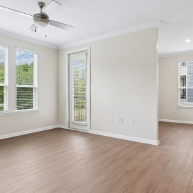 room with white walls and wood floors